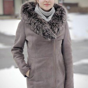 Hooded sheepskin coat with lush silver fox fur trim